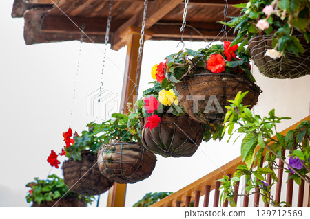 Beautiful balconies decorated with flowerpots on the streets of the colonial town of Concepcion in Antioquia, Colombia. Beautiful balconies decorated with flowerpots on the streets of the colonial town of Concepcion in Antioquia, Colombia. 129712569