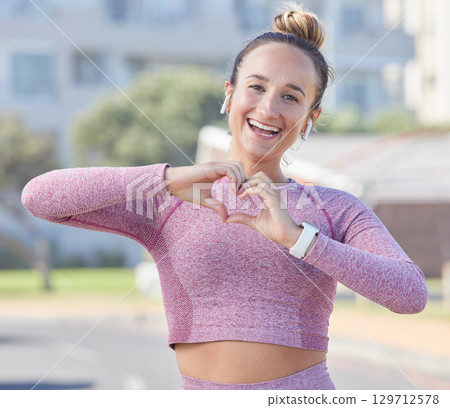 Fitness, woman and hand heart sign, happy in portrait and exercise outdoor with love symbol for sport motivation. Runner, freedom with earphones for music or podcast, excited for cardio and wellness Fitness, woman and hand heart sign, happy in portrait and exercise outdoor with love symbol for sport motivation. Runner, freedom with earphones for music or podcast, excited for cardio and wellness 129712578