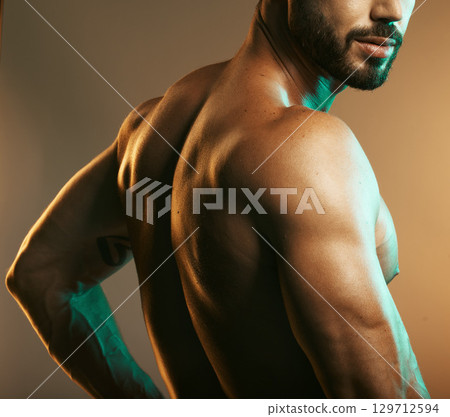 Man, body or back muscles on studio background with creative light aesthetic, training goals or workout progress. Zoom, skin or bodybuilder fitness model for healthcare wellness or exercise strength Man, body or back muscles on studio background with creative light aesthetic, training goals or workout progress. Zoom, skin or bodybuilder fitness model for healthcare wellness or exercise strength 129712594