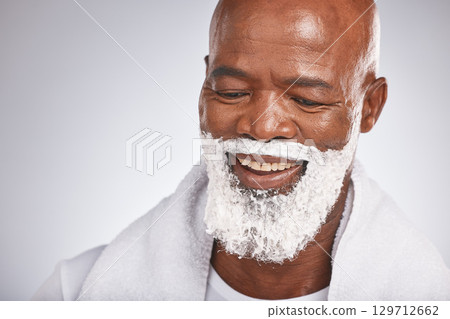Face, shaving cream and happy black man with smile on beard, skincare treatment on grey background. Health, mock up and facial hair, mature man morning shave routine with space for product placement. Face, shaving cream and happy black man with smile on beard, skincare treatment on grey background. Health, mock up and facial hair, mature man morning shave routine with space for product placement. 129712662