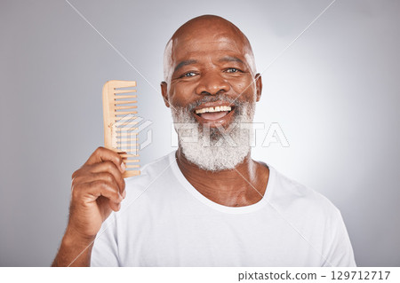 Senior black man with smile, comb and body hair, beauty and grooming with hygiene and cosmetic care against studio background. Hair care mockup, beard with portrait and face treatment and cosmetics 129712717