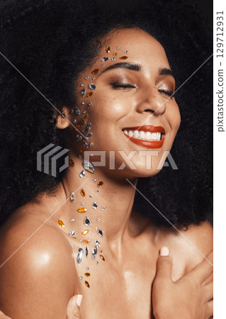Woman, face or body jewel rhinestones on black background studio for fashion sparkle, festival accessory or creative party crystals. Happy smile, afro beauty model and skin gems with makeup cosmetics Woman, face or body jewel rhinestones on black background studio for fashion sparkle, festival accessory or creative party crystals. Happy smile, afro beauty model and skin gems with makeup cosmetics 129712931