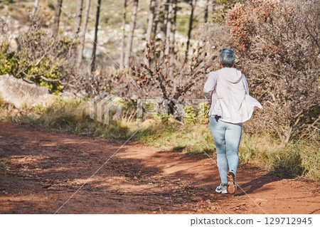 Fitness, runner or old woman running in nature training, exercise or cardio workout in New Zealand. Back view, wellness or healthy senior person exercising with resilience, body goals or motivation Fitness, runner or old woman running in nature training, exercise or cardio workout in New Zealand. Back view, wellness or healthy senior person exercising with resilience, body goals or motivation 129712945