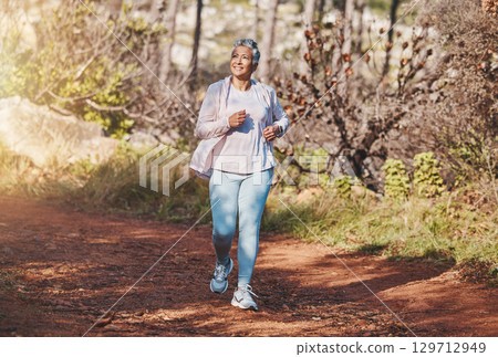 Fitness, happy or old woman running in nature cardio training, exercise or workout in New Zealand. Runner, freedom or healthy senior person smiles with pride, body goals or motivation in summer 129712949
