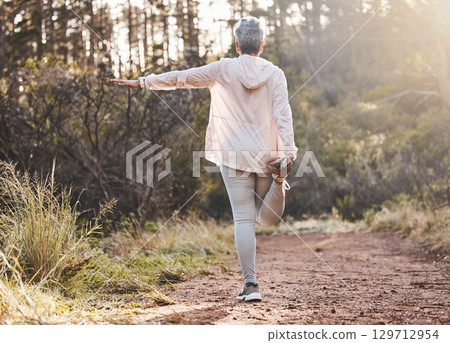 Fitness, forest or senior woman stretching in nature to start training, exercise or hiking workout in New Zealand. Back view, balance or healthy elderly person with focus, body goals or motivation 129712954