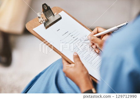 Nurse, clipboard and writing checklist for patient, healthcare consulting and medical information. Closeup doctor hands write documents, data and questions on wellness report, planning or paper admin 129712990