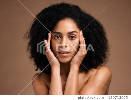 Skincare, afro and hair portrait of black woman with healthy aesthetic and natural texture. African grooming cosmetics model girl face with beautiful skin glow in brown studio background. 129713025