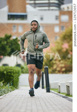Fitness, exercise and black man running in city in winter for health, wellness and strength. Sports, thinking and male runner exercising, cardio jog or training outdoors alone on street for marathon. Fitness, exercise and black man running in city in winter for health, wellness and strength. Sports, thinking and male runner exercising, cardio jog or training outdoors alone on street for marathon. 129713057