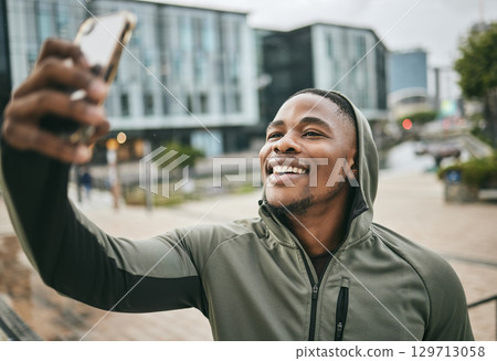 Phone selfie, fitness and black man in city taking picture for social media or happy memory outdoors in winter. Sports, training and male runner with 5g mobile smartphone taking a photo on street. 129713058