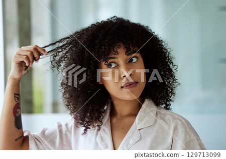 Morning, natural and black woman with hair care bathroom routine feeling curly hair texture. Beauty, self care and african girl thinking of cosmetic treatment in home with thoughtful face. Morning, natural and black woman with hair care bathroom routine feeling curly hair texture. Beauty, self care and african girl thinking of cosmetic treatment in home with thoughtful face. 129713099