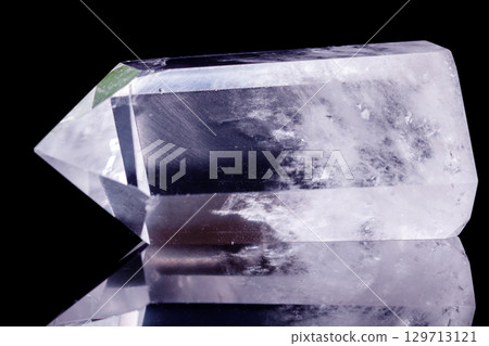 Macro mineral stone Crystal rock crystal on a black background 129713121