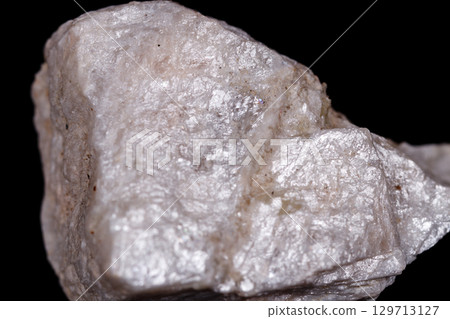 Macro mineral stone Wollastonite on black background 129713127