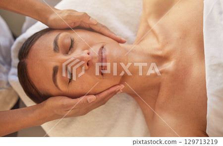 Woman, face and hands for massage in beauty salon for relax physical therapy, skincare wellness and luxury spa wellness. Masseuse, facial care and dermatology therapy for body care glow from above Woman, face and hands for massage in beauty salon for relax physical therapy, skincare wellness and luxury spa wellness. Masseuse, facial care and dermatology therapy for body care glow from above 129713219