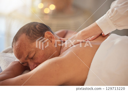 Spa, man and massage for peace, luxury and relax for health, peace and lying on table. Male person, rich and self care for healthy lifestyle, zen treatment and grooming for stress relief and wellness 129713220