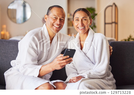 Senior couple at spa, portrait with smartphone and happy smile, wellness and commitment with romantic trip to luxury resort. Technology, phone and relax together, happiness and romance on holiday Senior couple at spa, portrait with smartphone and happy smile, wellness and commitment with romantic trip to luxury resort. Technology, phone and relax together, happiness and romance on holiday 129713228
