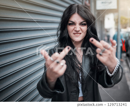 Face portrait, middle finger and woman in city with rude gesture or insult. Punk fashion, goth and female in street with anger, aggressive and bad hands sign, symbol or emoji for conflict expression Face portrait, middle finger and woman in city with rude gesture or insult. Punk fashion, goth and female in street with anger, aggressive and bad hands sign, symbol or emoji for conflict expression 129713241