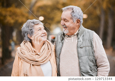 Senior couple, love and health while walking outdoor for exercise, happiness and care at a park in nature for wellness. Old man and woman together in a healthy marriage during retirement with freedom Senior couple, love and health while walking outdoor for exercise, happiness and care at a park in nature for wellness. Old man and woman together in a healthy marriage during retirement with freedom 129713344