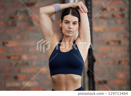 Fitness, portrait and woman stretching arms for gym exercise, workout or training in Australia. Female athlete with focus, warm up and body to start performance, wellness and energy for healthy goals 129713404