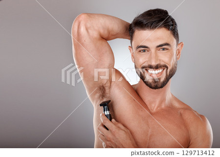 Face, man and armpit shaving for skincare in studio isolated on a gray background mockup. Portrait, hygiene and happy male model grooming, hair removal or epilation with electric trimmer for wellness Face, man and armpit shaving for skincare in studio isolated on a gray background mockup. Portrait, hygiene and happy male model grooming, hair removal or epilation with electric trimmer for wellness 129713412