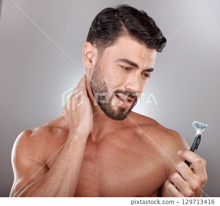 Razor, beauty or man in studio to shave beard in grooming marketing razor hair care products. Self care, studio background or healthy male model shaving for good skincare in morning routine treatment Razor, beauty or man in studio to shave beard in grooming marketing razor hair care products. Self care, studio background or healthy male model shaving for good skincare in morning routine treatment 129713416