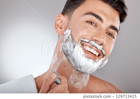 Grooming, foam and shaving with face of man with razor for beauty, hygiene and skincare with morning routine. Self care, facial and shave beard with model and cream product for wellness and cleaning 129713425
