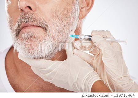 Man face, hands or cosmetic surgery injection on studio background for skincare collagen, medical dermatology or anti aging grooming. Zoom, plastic surgeon or mature patient needle for facial change Man face, hands or cosmetic surgery injection on studio background for skincare collagen, medical dermatology or anti aging grooming. Zoom, plastic surgeon or mature patient needle for facial change 129713464