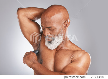 Product, armpit or senior black man with deodorant for healthy body hygiene in grooming morning routine. Studio mockup, self care or old man with underarm roll on for wellness, skincare or self love Product, armpit or senior black man with deodorant for healthy body hygiene in grooming morning routine. Studio mockup, self care or old man with underarm roll on for wellness, skincare or self love 129713489