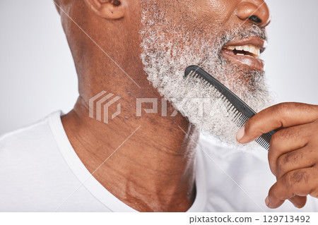 Elderly, black man and comb for beard, beauty and grooming with hygiene and cleaning face zoom. Hair care, brush body hair and wellness with cosmetic care and natural against studio background 129713492