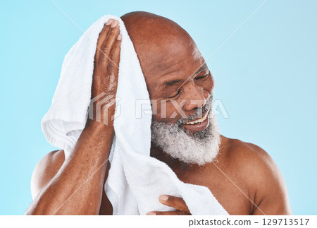 Shower, senior man and towel for cleaning, cosmetics and hygiene against blue studio background. Black male, mature guy and cloth for skincare, dry and spa body care for beauty, retirement and luxury Shower, senior man and towel for cleaning, cosmetics and hygiene against blue studio background. Black male, mature guy and cloth for skincare, dry and spa body care for beauty, retirement and luxury 129713517