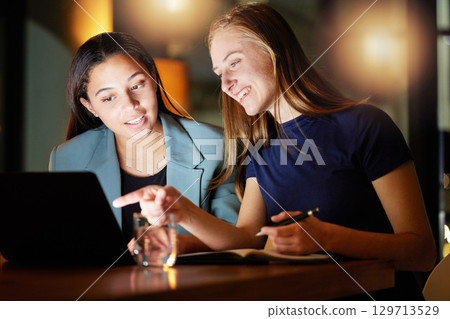 Business, women and talking at night, laptop and explain process, system and office. Female employees, girls and manager with consultant, computer and schedule for deadline, campaign project and tech 129713529