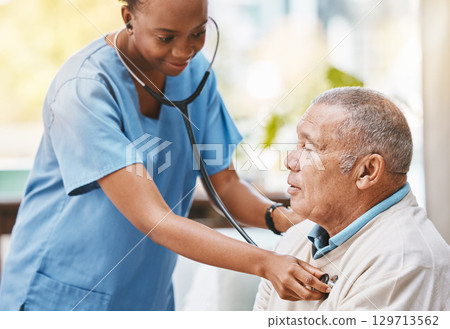 Nurse, senior patient and stethoscope for healthcare service, caregiver career or heart check in hospital, clinic or retirement home. Nursing, consulting and cardiology of elderly man and black woman 129713562