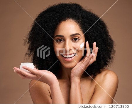 Cream product, studio and skincare woman in portrait for facial, natural cosmetics or beauty wellness in studio mockup. Black woman model for face sunscreen, collagen or dermatology container in hand Cream product, studio and skincare woman in portrait for facial, natural cosmetics or beauty wellness in studio mockup. Black woman model for face sunscreen, collagen or dermatology container in hand 129713590