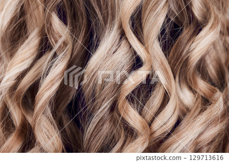 Beauty, hair care and hair closeup of woman in studio after salon treatment for growth, texture or balayage. Wellness, wavy hair style and macro of female model with long, healthy and beautiful hair. 129713616