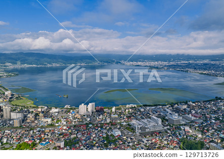Lake Suwa and the townscape of Suwa and Okaya seen through the clouds (aerial drone shot) Lake Suwa and the townscape of Suwa and Okaya seen through the clouds (aerial drone shot) 129713726