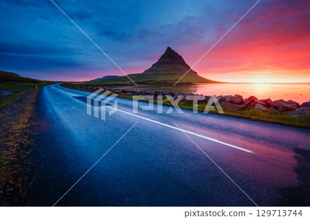 Evening Kirkjufell volcano the coast of Snaefellsnes peninsula. Location Kirkjufellsfoss waterfall. 129713744