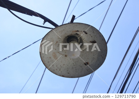lighting on electric poles with a blue sky nuance lighting on electric poles with a blue sky nuance 129713790