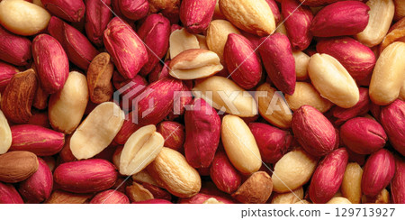 Discover the natural goodness of these raw peanuts, a mix of both red-skinned and blanched varieties. Ideal for healthy snacking, adding to recipes, or making your own fresh peanut butter. 129713927