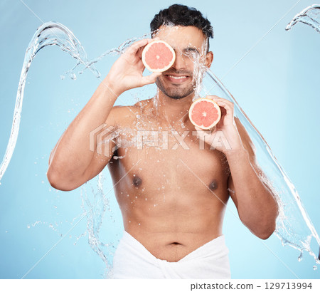 Skincare, beauty and water splash, man with fruit for vitamin c facial detox for healthcare, natural healthy skin and smile. Water, wellness and sustainability, organic luxurycleaning and grooming. Skincare, beauty and water splash, man with fruit for vitamin c facial detox for healthcare, natural healthy skin and smile. Water, wellness and sustainability, organic luxurycleaning and grooming. 129713994