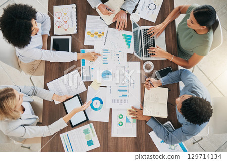 Above, business people and meeting at table with chart, documents and data analysis with teamwork. Digital marketing group, paper and analytics with seo data, target and planning for goal in Atlanta 129714134