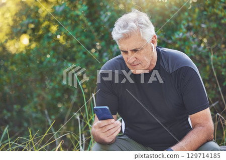 Fitness, phone or old man streaming a podcast, radio music or motivational audio for running exercise or workout. Wellness, relaxing or senior person listening to a song in headphones in nature park Fitness, phone or old man streaming a podcast, radio music or motivational audio for running exercise or workout. Wellness, relaxing or senior person listening to a song in headphones in nature park 129714185
