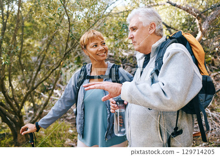 Relax, senior or couple of friends hiking, walking or trekking for freedom, exercise or fitness in nature forest. Interracial, travel or happy woman enjoys bonding time with healthy elderly partner Relax, senior or couple of friends hiking, walking or trekking for freedom, exercise or fitness in nature forest. Interracial, travel or happy woman enjoys bonding time with healthy elderly partner 129714205