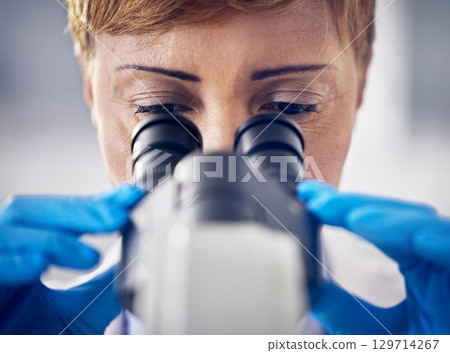 Science, laboratory and black woman with microscope, research for vaccine development. Healthcare, medical innovation and senior scientist woman in hospital lab looking at pharmaceutical test results 129714267