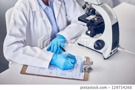 Research, clipboard and scientist writing, checklist and schedule form in laboratory. Science, researchers and make notes for data analysis, sample test and innovation for healthcare and medical cure 129714268