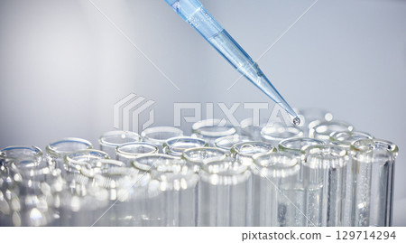 Science, test tubes and syringe for research, experiment or project in chemistry laboratory. Glass vials, innovation and chemical liquid for scientific innovation or analysis in a pharmaceutical lab. Science, test tubes and syringe for research, experiment or project in chemistry laboratory. Glass vials, innovation and chemical liquid for scientific innovation or analysis in a pharmaceutical lab. 129714294