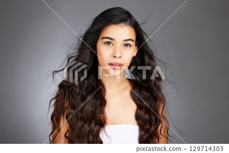 Hair, hair care and woman, face and beauty, glow and shine with keratin treatment. Cosmetic mockup, waves and texture with hair style with studio background. Wellness, self care portrait and growth. 129714303