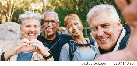 Nature, selfie and senior friends hiking together in a forest while on an outdoor adventure. Happy, smile and portrait of a group of elderly people trekking in woods for wellness, health and exercise Nature, selfie and senior friends hiking together in a forest while on an outdoor adventure. Happy, smile and portrait of a group of elderly people trekking in woods for wellness, health and exercise 129714386