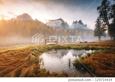 Stunning image of the foggy lake Antorno in National Park Tre Cime di Lavaredo. 129714434