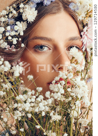 Woman, beauty and flower portrait for natural skincare, cosmetics makeup and floral head crown. Spring flowers, organic body care and skin wellness with facial headshor or dermatology glow in studio Woman, beauty and flower portrait for natural skincare, cosmetics makeup and floral head crown. Spring flowers, organic body care and skin wellness with facial headshor or dermatology glow in studio 129714580