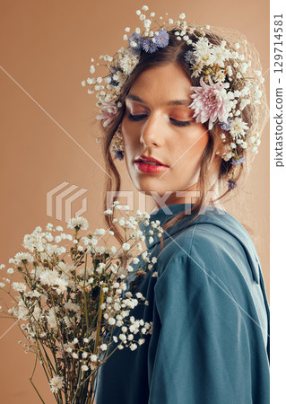 Beauty, makeup and woman with flower, crown and skincare in studio, wellness and creative on brown background mockup. Flowers, girl and model with nature aesthetic, luxury and eco friendly product 129714581