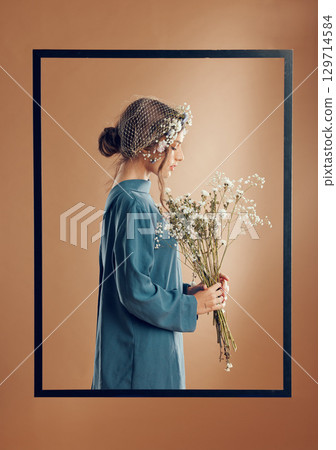 Flowers, creative aesthetic and woman in a frame, spring beauty and pop art against a brown studio background. Peace, minimalism and side of a model with a flower bouquet, zen and calm sustainability Flowers, creative aesthetic and woman in a frame, spring beauty and pop art against a brown studio background. Peace, minimalism and side of a model with a flower bouquet, zen and calm sustainability 129714584